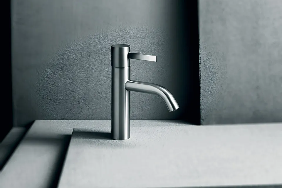 brushed steel single-lever basin mixer with a curved spout