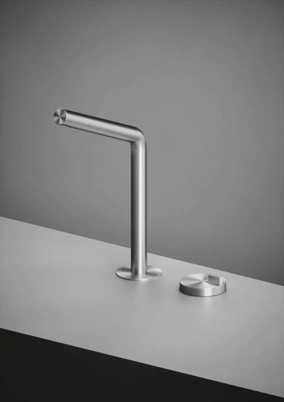 single-hole basin mixer with a right-angled spout in brushed steel